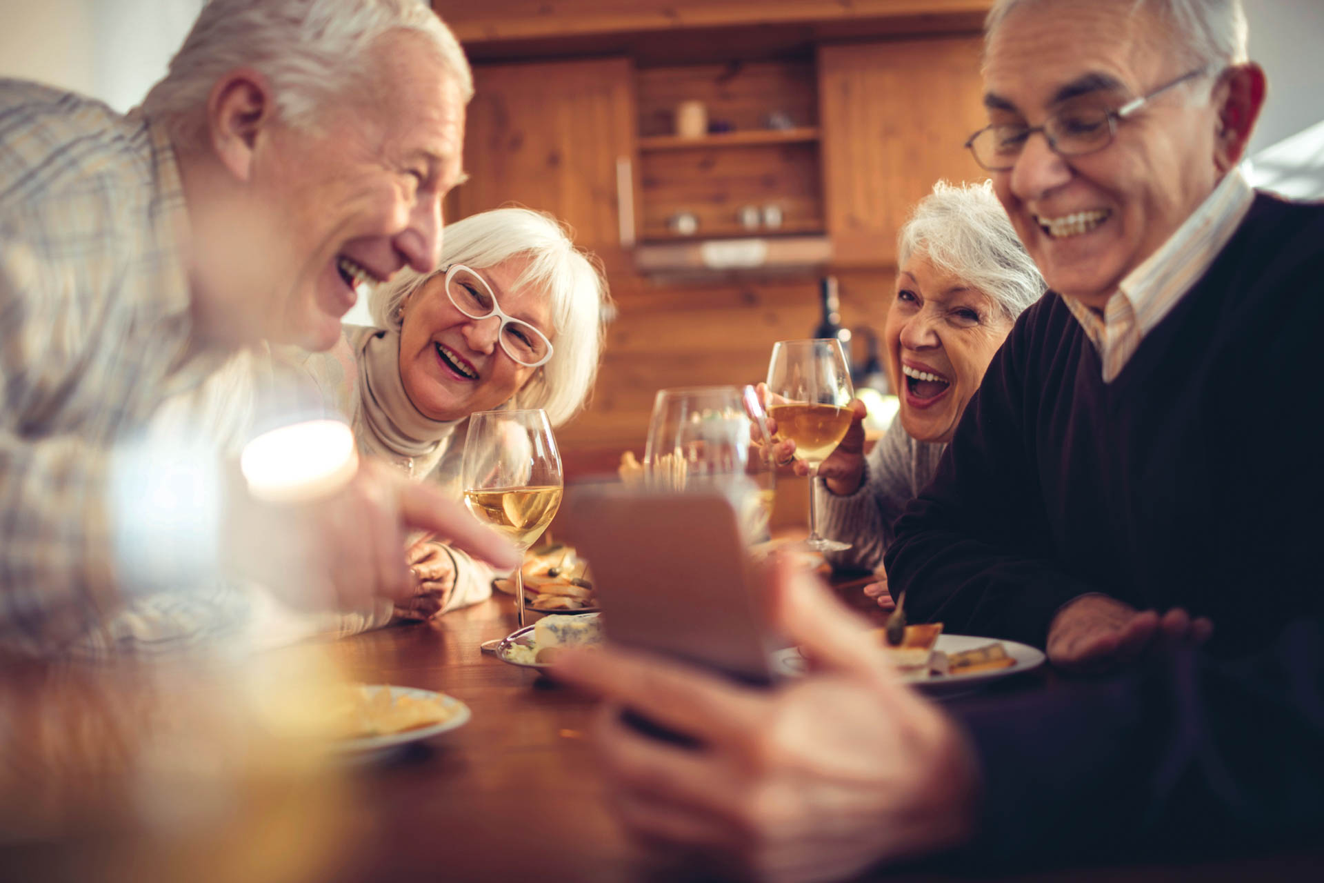 Photo of senior adults laughing together.