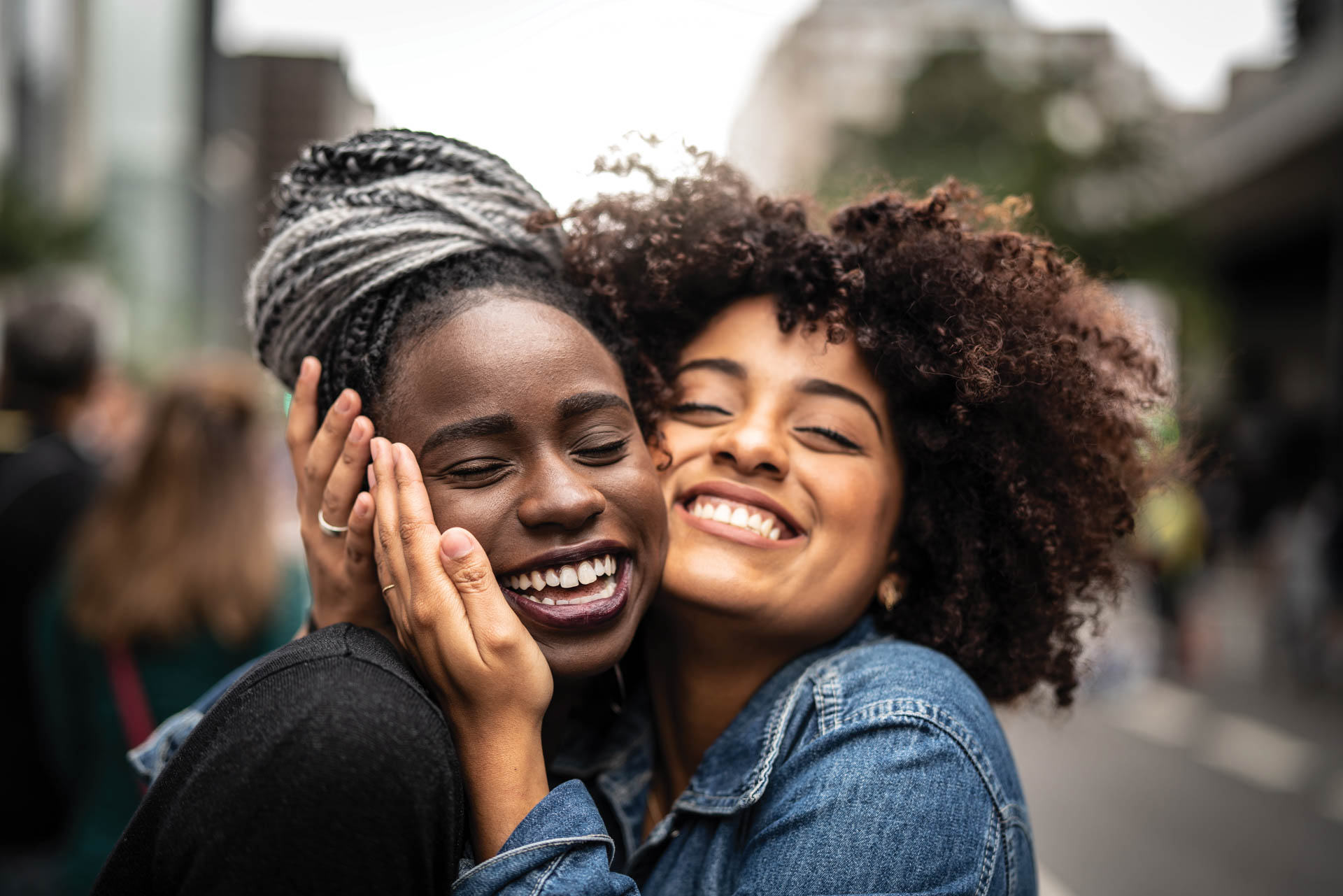 Two friends hugging.