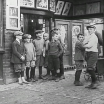 Group of kids in the 1950s playing together on the street.