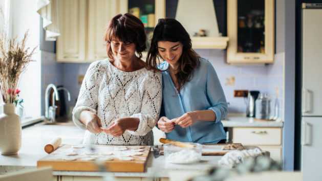 Mother and daughter baking in the kitchen.