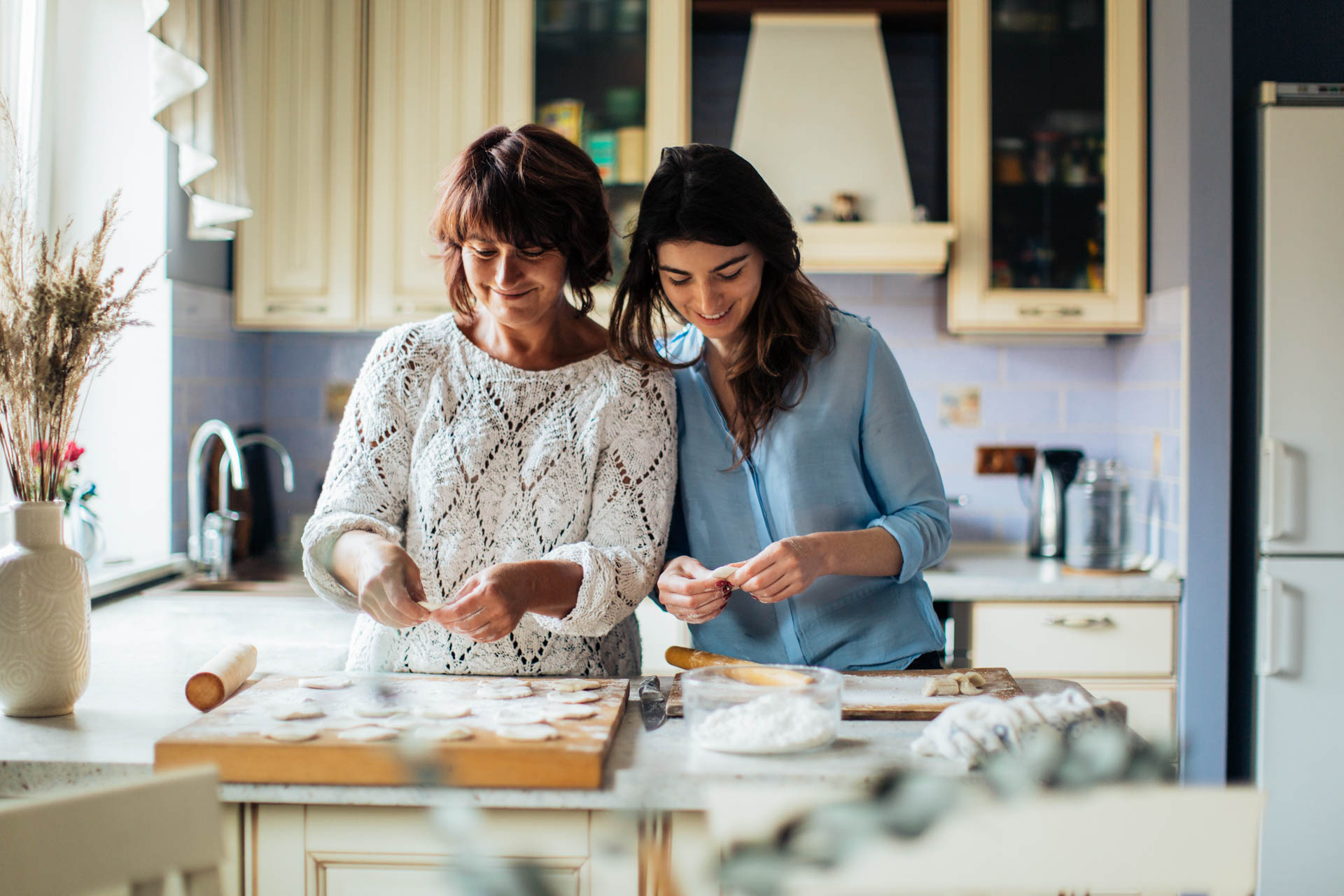 Mother and daughter baking in the kitchen.