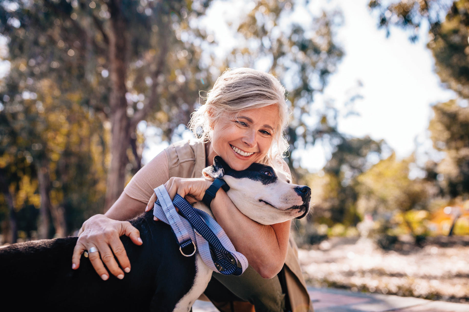 Woman hugging her dog.